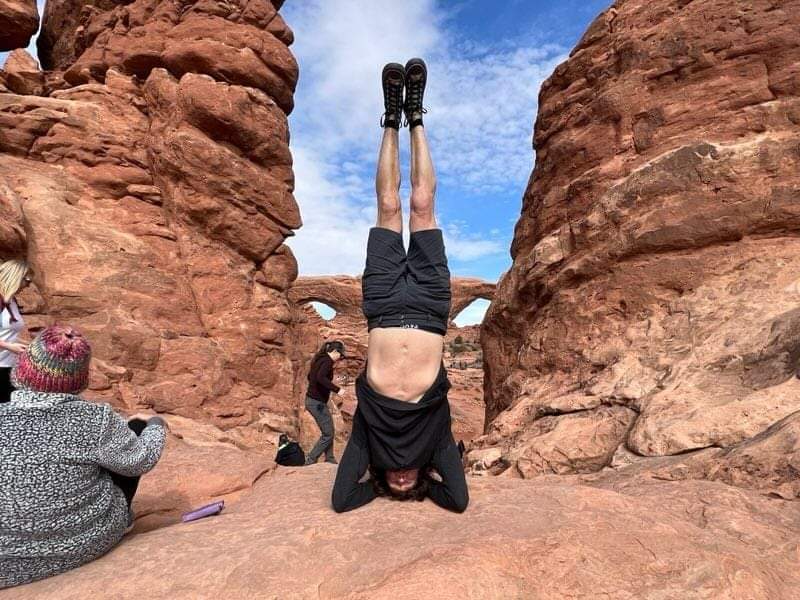 Doing a headstand at Arches National Park