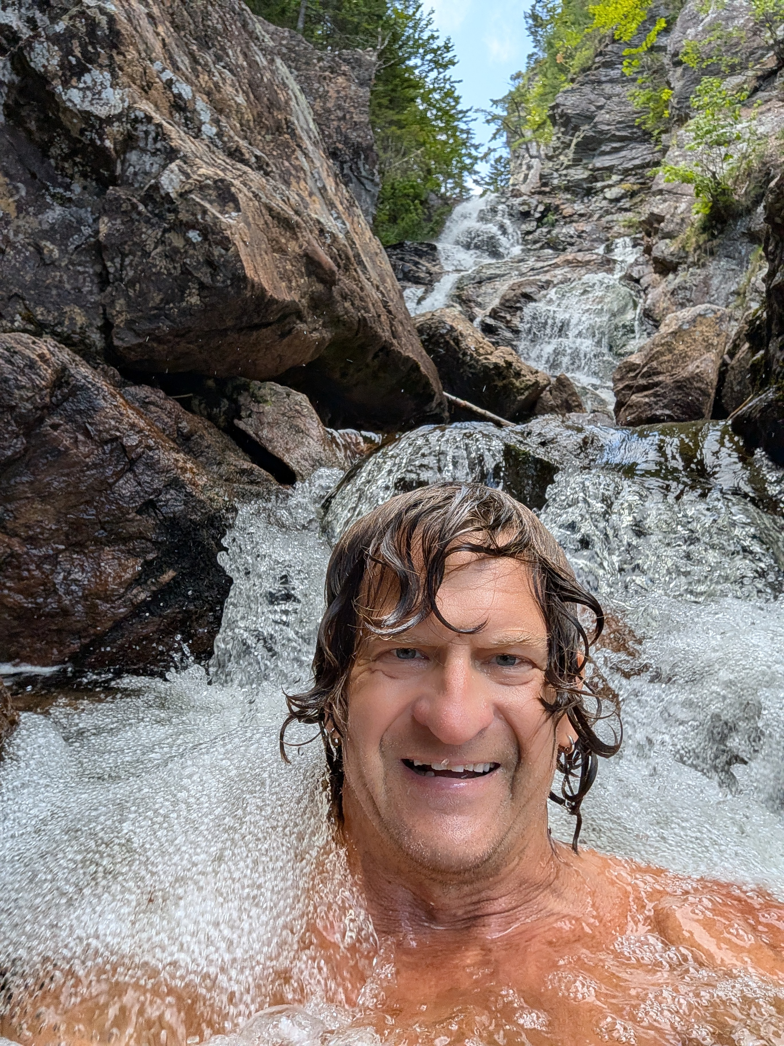 Standing under a waterfall